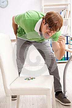 Office prank with sharp thumbtacks on chair