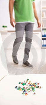 Office prank with sharp thumbtacks on chair