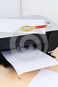 Office printer close up on a wooden table