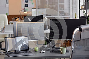 Office Programming Desk Setup with Computer and Laptop