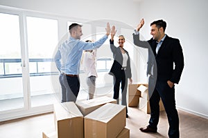 Office Relocation. Executives Making High Five