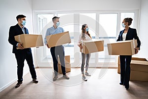 Office Relocation. Executives Moving Cardboard Boxes