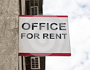 Office for rent sign on a building