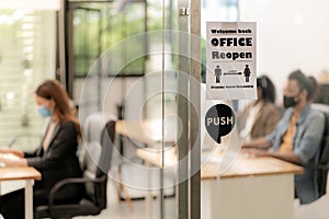 Office reopen with social distance signage photo