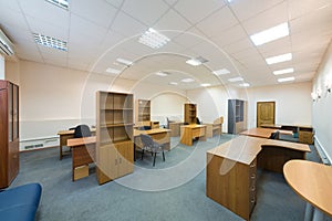 Office room with empty furniture and