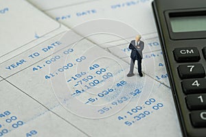 Office salary man or tax calculation concept, miniature figure b