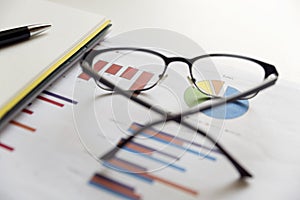 Office scene: financial graphs and charts. Financial data concept