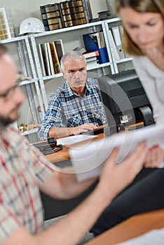 Office scene three workers