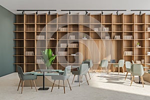 Office service area with beige and green details and large shelving