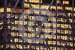 Office skyscraper windows at night