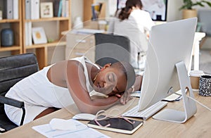 Office, sleeping or tired black woman resting on table with burnout is overworked by deadlines at desk. Lazy, dreaming