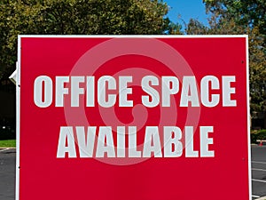 Office Space Available large sign near vacant building advertising the real estate, property, office for sale, rent or lease