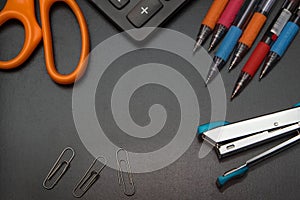 Office stationery on black background, back to shcool co