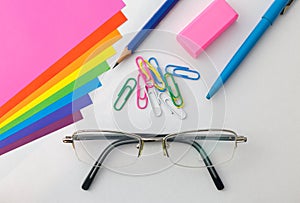 Office supplies with reading glassess.