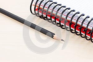 Office table with blank notepad and pencil