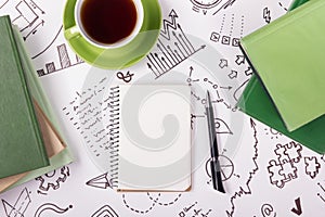 Office table desk with supplies, blank note pad, cup, pen on white background of business strategy. Top view copy space