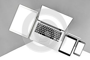 Office table with laptop computer, digital tablet, smartphone, p