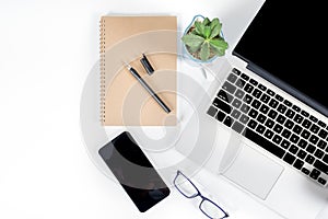 Office table with laptop computer, smartphone, pen, notebook and coffee on isolated pure white background / Laptop and tablet mock
