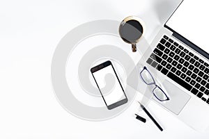 Office table with laptop computer, smartphone, pen, notebook and coffee on isolated pure white background / Laptop and tablet mock