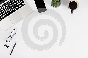 Office table with laptop computer, smartphone, pen, notebook and coffee on isolated pure white background / Laptop and tablet mock