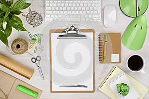 Office table with paper holder in center and various supplies