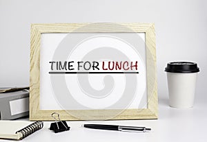 Office table with wooden frame with text - Time for lunch