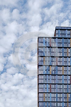 office tower glass tree reflections wide angle office building cloudy sky blue windows financial corporate business