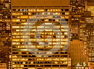 Office windows illuminated at night