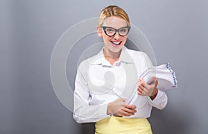 Office woman with a stack of documents