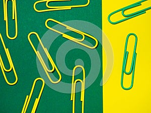 Office work. Colored paper clips. Colored paper with staples. Colorful office supplies