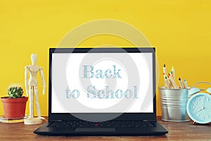 office work place with open leptop and empty white screen for copy space