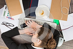 Office worker asleep at his desk