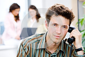 Office worker calling on phone