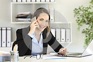 Office worker calling on phone looking at you