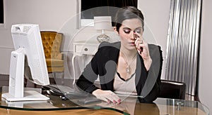 Office Worker Endures Headache at Work Station