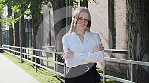 Office worker folding hands, business portrait of successful woman.