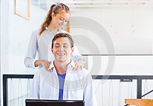 Office worker getting massage on his workplace