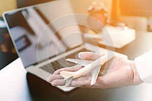 Office worker hand holding a plan business travel