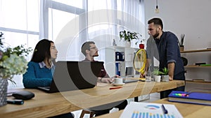 Office worker having fun with tennis racket