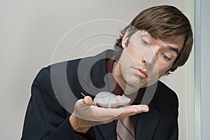 Office worker holding a plastic mouse