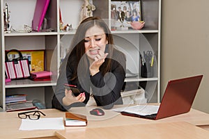 Office worker in horror looking at phone