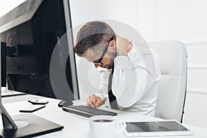 Office worker with pain from sitting at desk all day