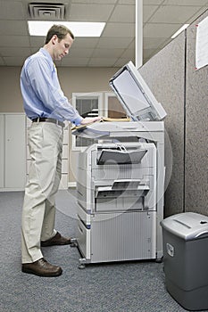 Office worker photocopying