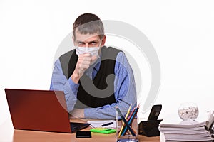 Office worker in a protective mask coughs in the office