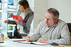 office worker in real office thinking