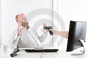 Businessman Threatened by Computer photo