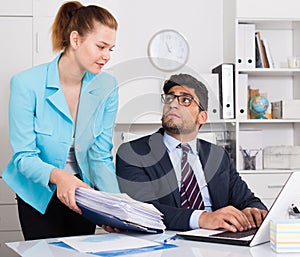 Office worker shocked by stack of papers