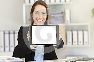 Office worker showing at camera blank tablet screen