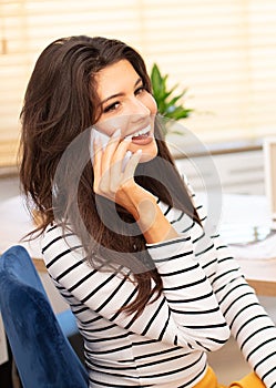 Office worker talking by mobile phone