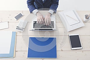 Office worker typing on a laptop